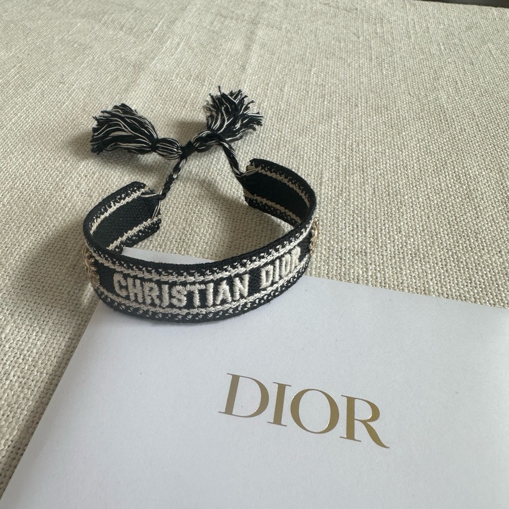 Christian Dior woven friendship bracelet black and white adjustable tassel